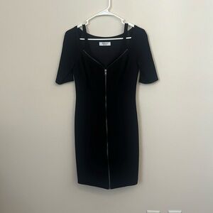 Little black dress. Zip up, 3/4 sleeves. Size small.